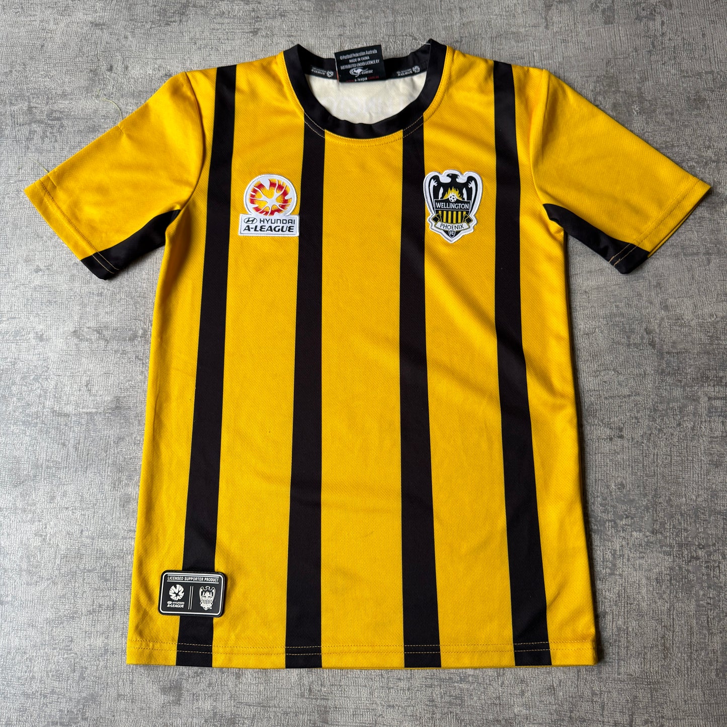 Wellington Phoenix Hyundai A-League Yellow Football Jersey Size 12y Fits XS-S Womens         -H9