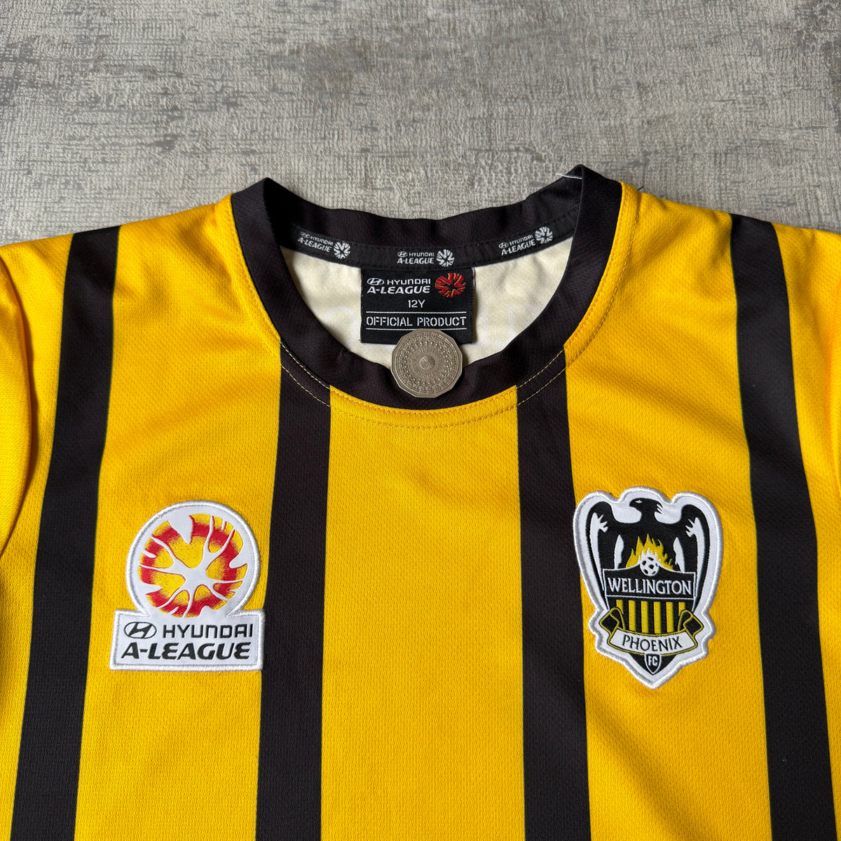 Wellington Phoenix Hyundai A-League Yellow Football Jersey Size 12y Fits XS-S Womens         -H9