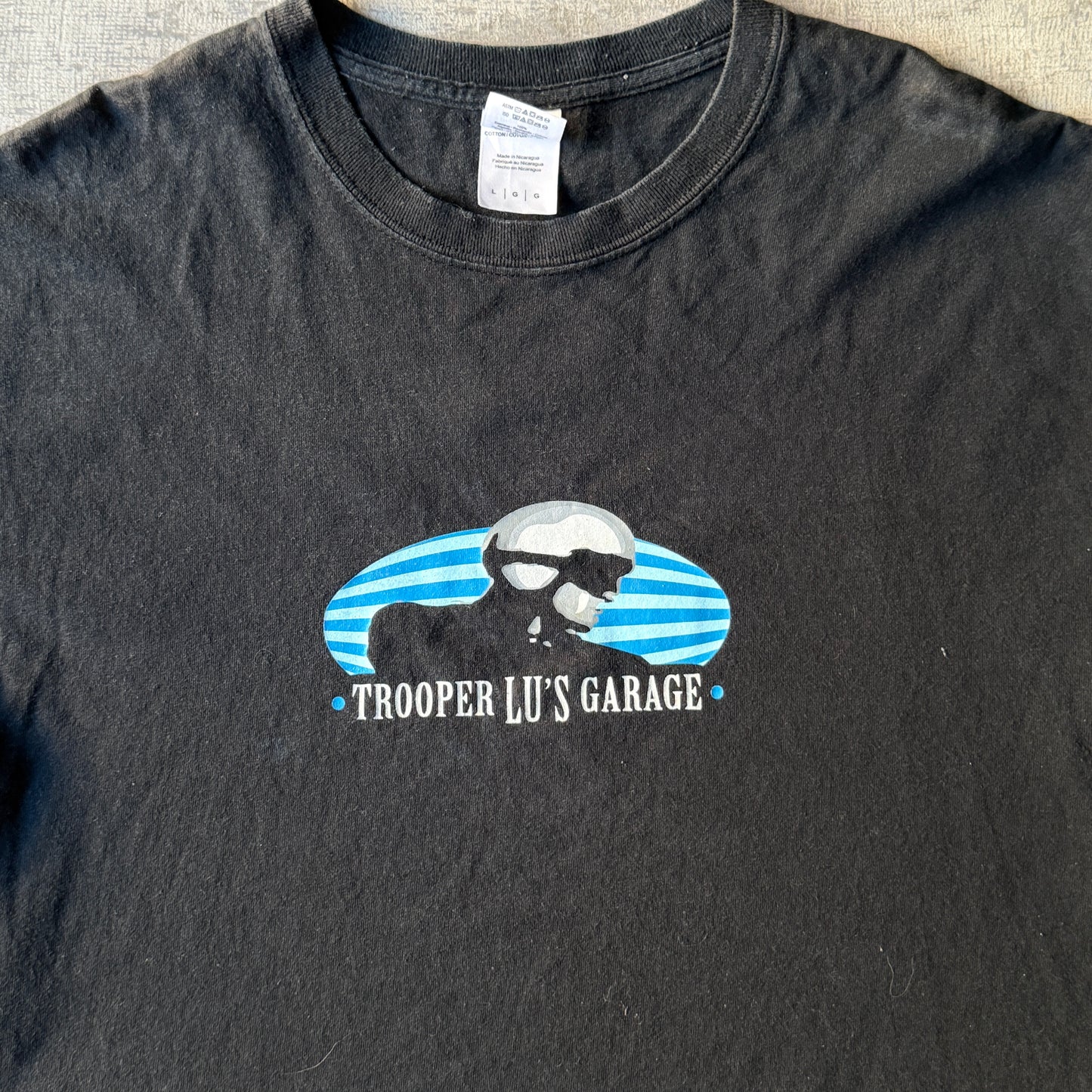 Vintage Mens Black Gildan Graphic Tee "Trooper Lu's Garage" Size L Mens               -D60